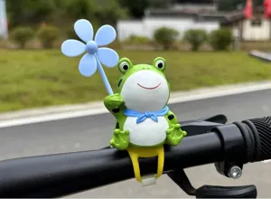 Cute frog bicycle accessory with windmill propeller, fun handlebar decor for e-bike motorcycle.