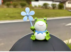 Cute frog helmet decoration with blue flower propeller accessory for electric bike and bicycle.