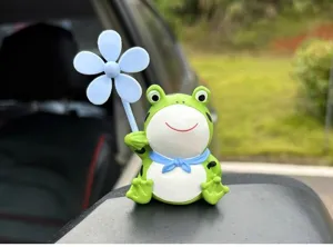Cute cartoon frog decoration with blue pinwheel for bicycle, motorcycle and car interior use.