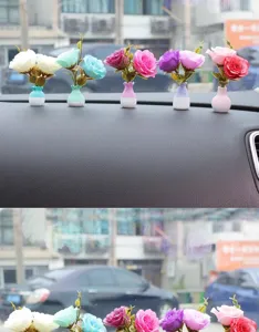 Close-up of mini artificial flower vase car ornaments displayed on the dashboard, colorful decor.