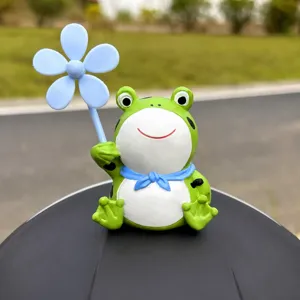 Cute frog helmet decoration figurine with pinwheel, perfect for motorcycle and bicycle accessories.