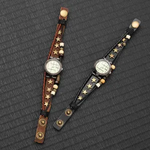 Close-up of vintage multi-layer leather straps featuring star studs and beaded details
