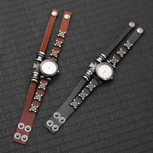 Vintage punk leather bracelet watches in brown and black with metal rivet details.