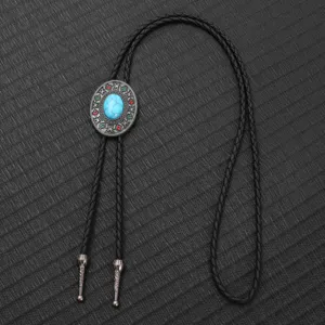 Detailed close-up of a vintage western bolo tie with turquoise pendant and black braided cord