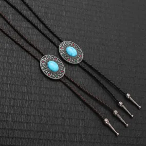 Close-up of vintage western bolo ties with turquoise stones and braided leather cords