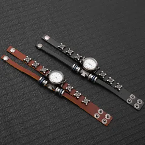 Detailed view of vintage punk leather bracelet watches with metal cross charms