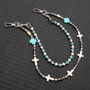 Detail view of double-layered beaded cross chain for punk hip hop jean decoration