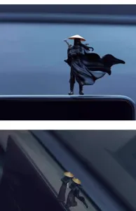 Miniature Chinese swordsman figurine for car dashboard or computer screen decoration.