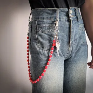 Punk style red skull pants chain accessory shown on blue denim jeans for men and women