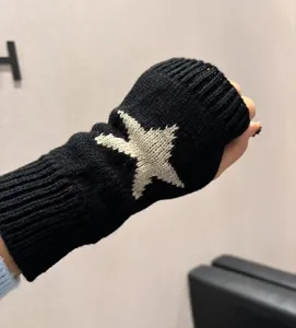 Black knit fingerless gloves with vintage star pattern for autumn and winter warmth.