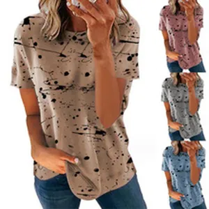 Close-up detail shot of women's short sleeve t-shirt with abstract splatter print design.