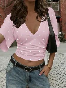 Chic pink polka dot v-neck crop t-shirt for women, stylish slim fit summer casual top.