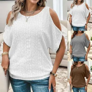 Women summer cold shoulder short sleeve cut out textured blouse casual top with denim jeans.