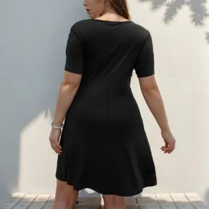 Detailed back view of women's short sleeve black V-neck mini dress, casual outfit.