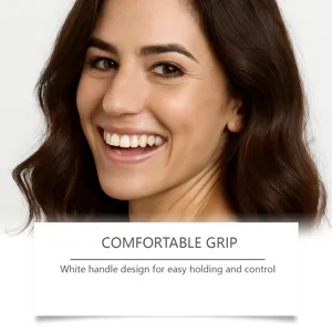 Detail view of comfortable grip and white handle design for easy daily hair brushing.
