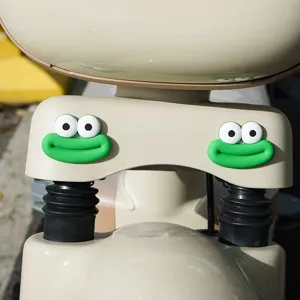Close-up detail of cute big mouth monster decorative sticker for electric scooter body.