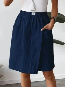 Detailed view of womens casual pocket skort in dark blue with elastic waist and comfortable fit.