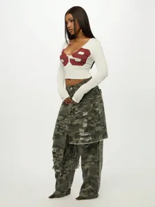 Sexy cropped long sleeve T-shirt with number print and camo cargo pants outfit.