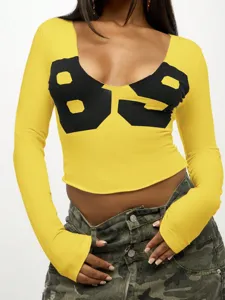 Trendy women's yellow long sleeve crop top u-neck slim fit t-shirt with black number print