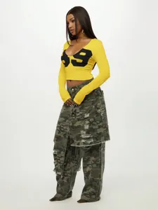Women yellow long sleeve crop top with black number print sexy streetwear detail view.