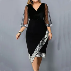 Elegant black velvet midi dress featuring sheer mesh sleeves with glittering details and sequin trim.