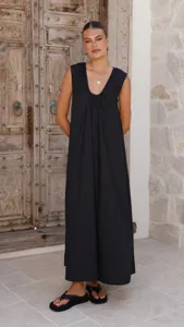 Black sleeveless U-neck maxi dress with pleated collar detail, elegant summer apparel.