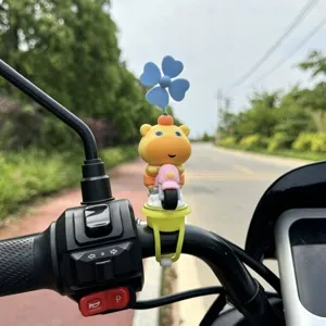 Detail shot of cute capybara scooter decoration with rotating wind spinner for bikes.