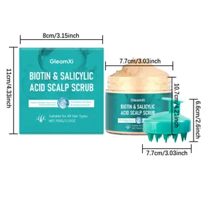 Detail view of GleamXi biotin and salicylic acid scalp scrub jar, box, and massage brush.