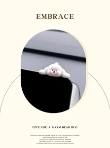Cute white dog car screen detail ornament, adorable blushing expression interior decor piece.