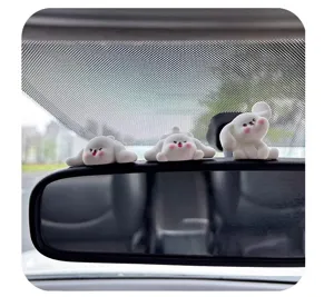 Cute cartoon white dog detail view, perfect for car rearview mirror and dashboard interior decor.