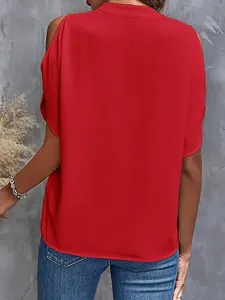 Detail view of a stylish red solid color cold shoulder V-neck short sleeve summer blouse.