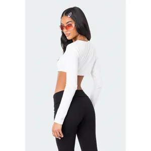 Γυναικείο σετ στενό μονόχρωμο crop top μακρυμάνικο και παντελόνι χαμηλής μέσης.