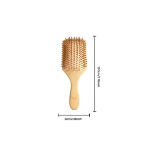 Wooden cushion hair brush with massage pins, natural bamboo daily scalp care tool detail view.