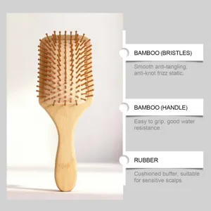 Natural bamboo paddle hair brush with wooden bristles and rubber cushion for daily care.