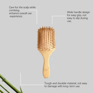 Bamboo paddle hair brush detail showing soft cushion pins and ergonomic wide handle.