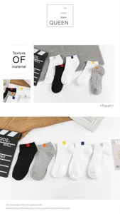 Detailed view of casual short socks with solid colors and colorful ribbed tabs for daily wear.