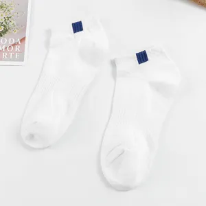 Men's white short boat socks with blue ankle stripes, breathable and comfortable casual wear.