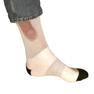 Detail view of funny novelty prank socks with black heel and toe, comfortable daily wear.