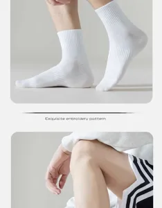 Detail view of men white cotton crew socks, soft texture and comfortable fit for daily wear.