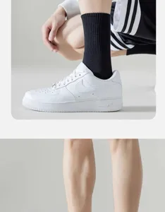 Men's cotton mid-tube sports socks paired with classic white casual sneakers for daily wear.