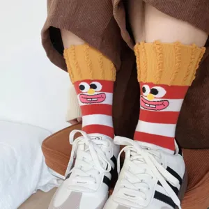 Close-up detail of cute dopamine cartoon french fries mid-tube socks with funny face design.