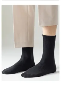Men's black ribbed cotton mid-calf socks detailed view showing daily wear comfort and texture.