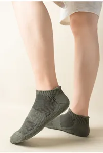 Detail view of breathable athletic sports socks with towel bottom and heel pull tab.