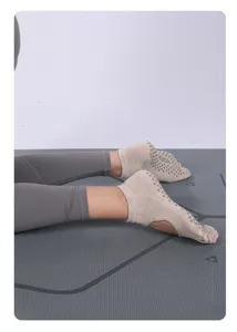 Breathable open back yoga socks with non-slip grips, perfect for pilates and fitness workouts.