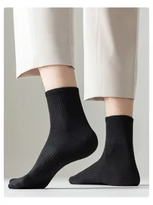 Men's black cotton crew socks detail view, breathable and comfortable athletic casual wear.
