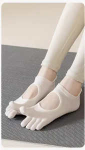 Breathable five-toe yoga socks detail, open back design for flexibility and comfort in pilates.
