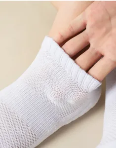 Breathable white sports socks with mesh detail, comfortable athletic short socks for running.