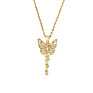 Close-up of a gold butterfly necklace featuring baguette and round zircon tassels