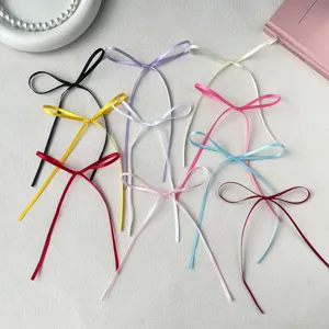 Colorful satin ribbon bows detail closeup, ideal for cake decoration and baking crafts.