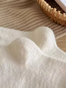 Close-up view of soft plush winter sock texture, showcasing warm and cozy fleece material.
